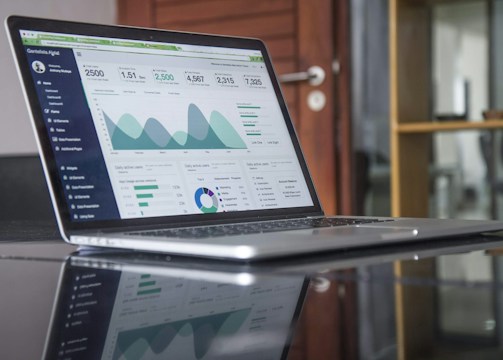 Laptop displaying analytics dashboard representing creative marketing campaigns