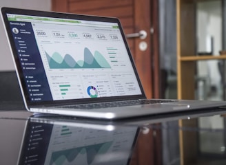Laptop displaying analytics dashboard representing creative marketing campaigns