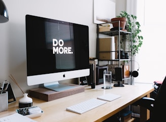 Modern workspace with iMac and organized desk representing client-focused marketing