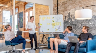 Team brainstorming marketing strategies and solutions in a modern office environment.